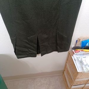 Black straight skirt. Pleated in back. Size 14,length 25.5. Color black